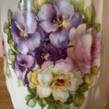Old ceramic pitcher decorated with flowers