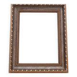Unique mirror in a gold frame.