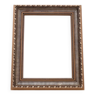 Unique mirror in a gold frame.