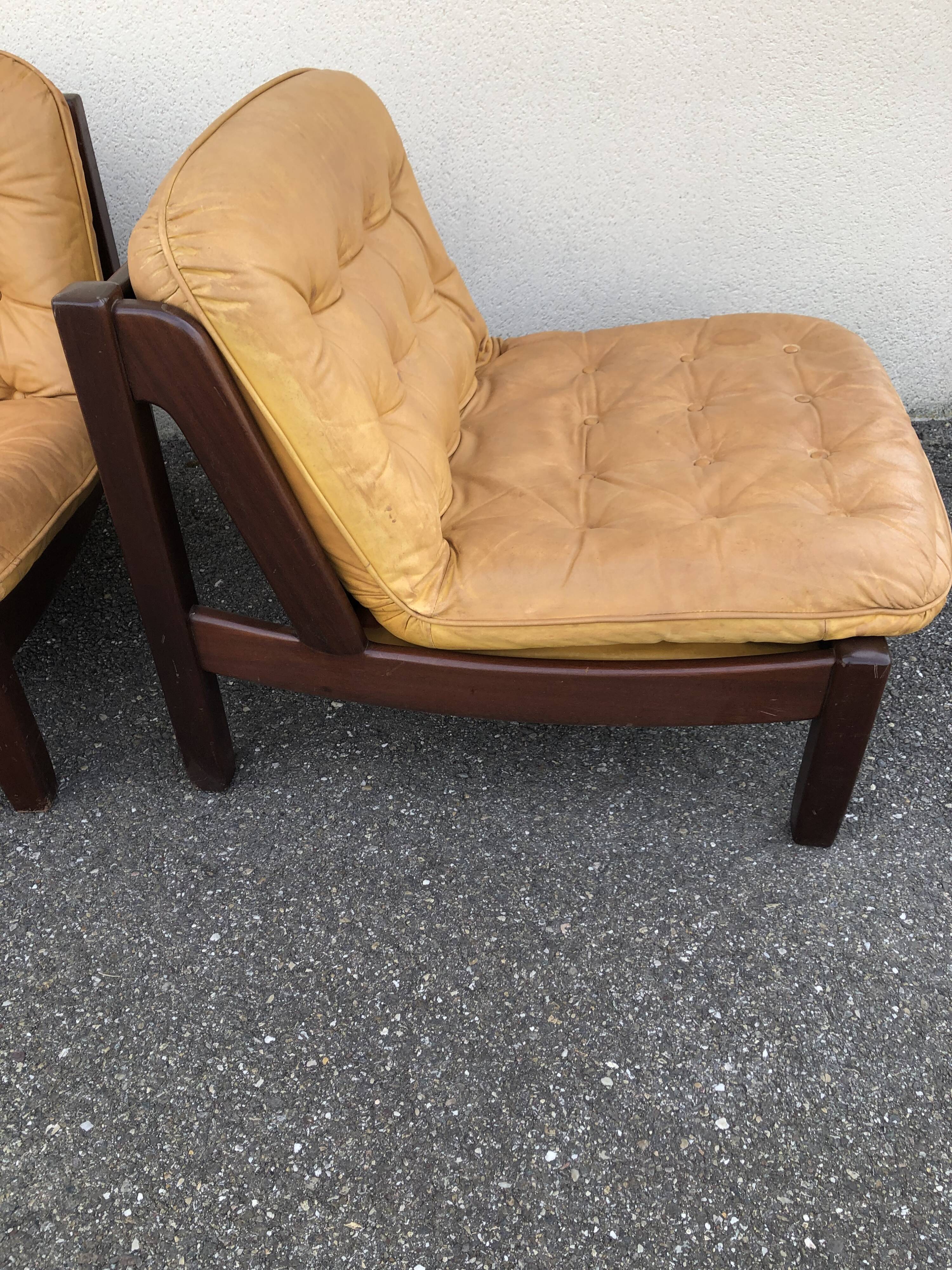 Leather and wood armchairs 70s