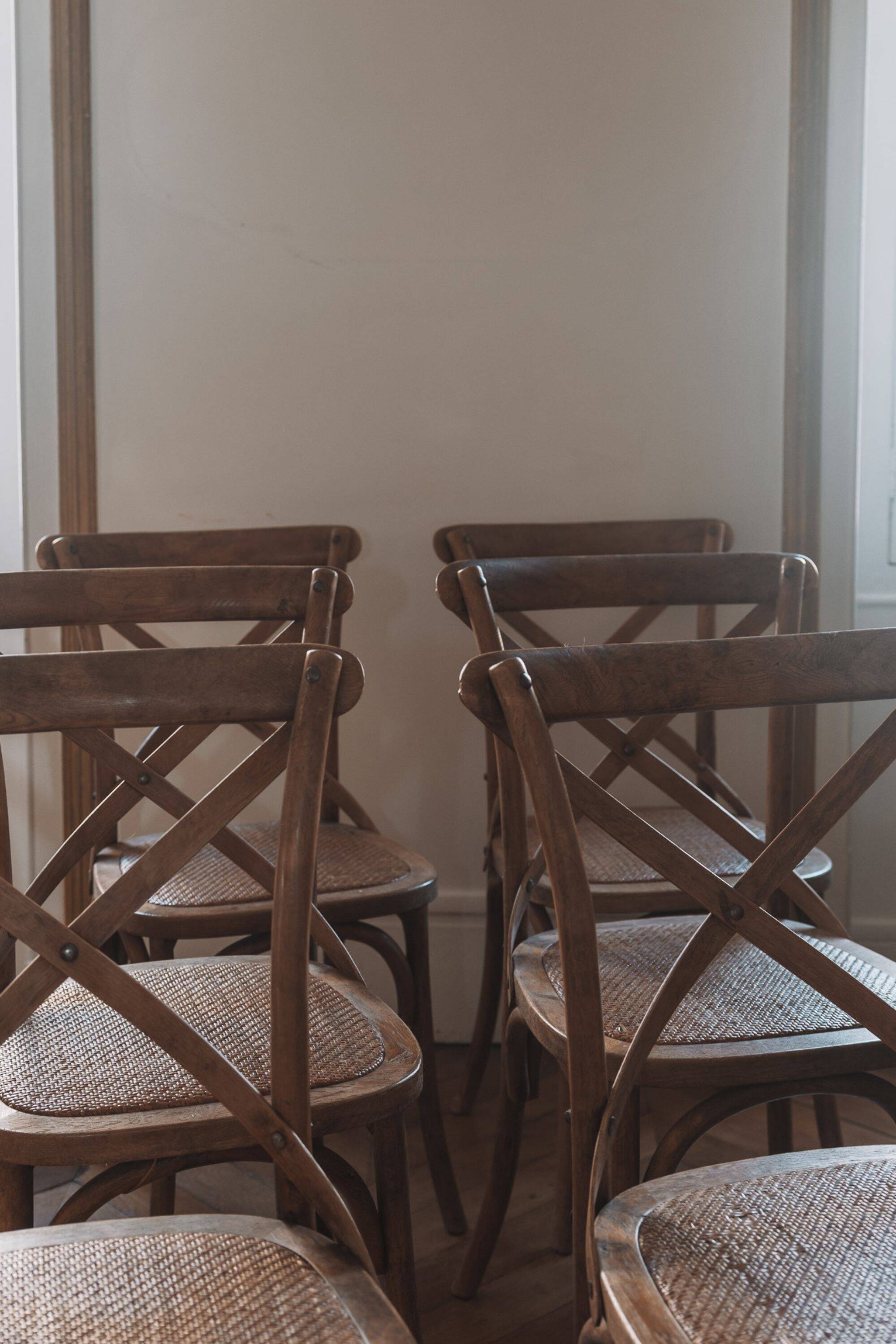 Bistro chairs with cross-back, cane seat.