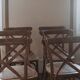 Bistro chairs with cross-back, cane seat.