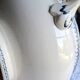 Antique mismatched earthenware soup plates with a tureen