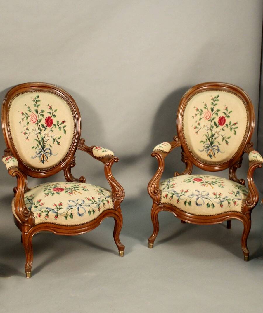Pair of Louis Philippe armchairs with petit point upholstery.