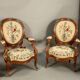 Pair of Louis Philippe armchairs with petit point upholstery.