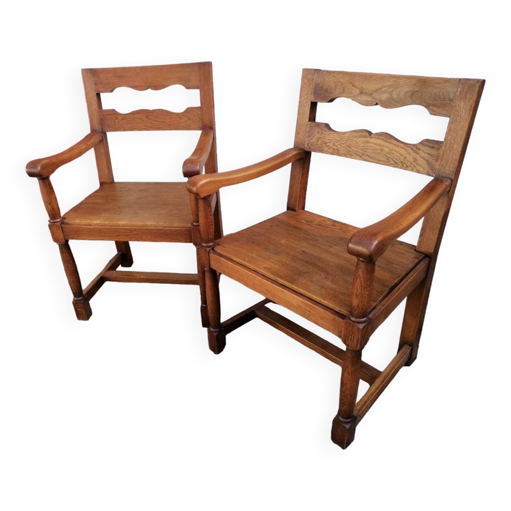 Pair of vintage oak armchairs with geometric design.