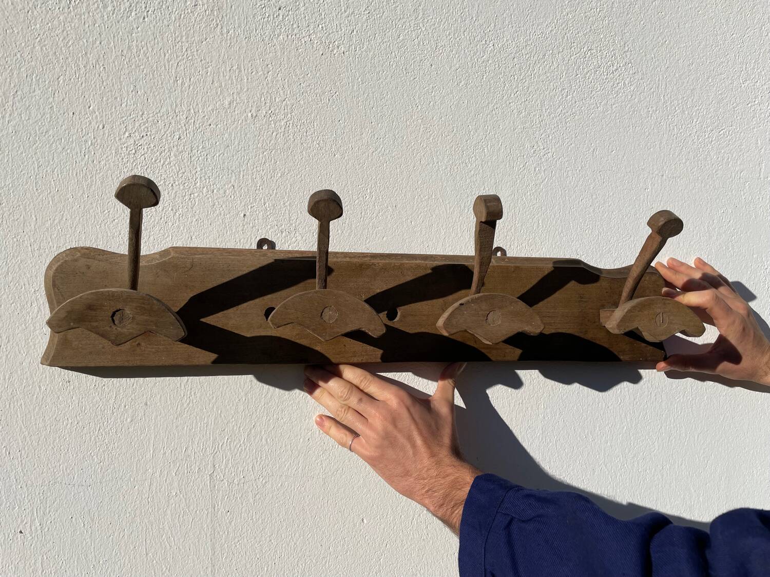 Wooden wall-mounted coat rack