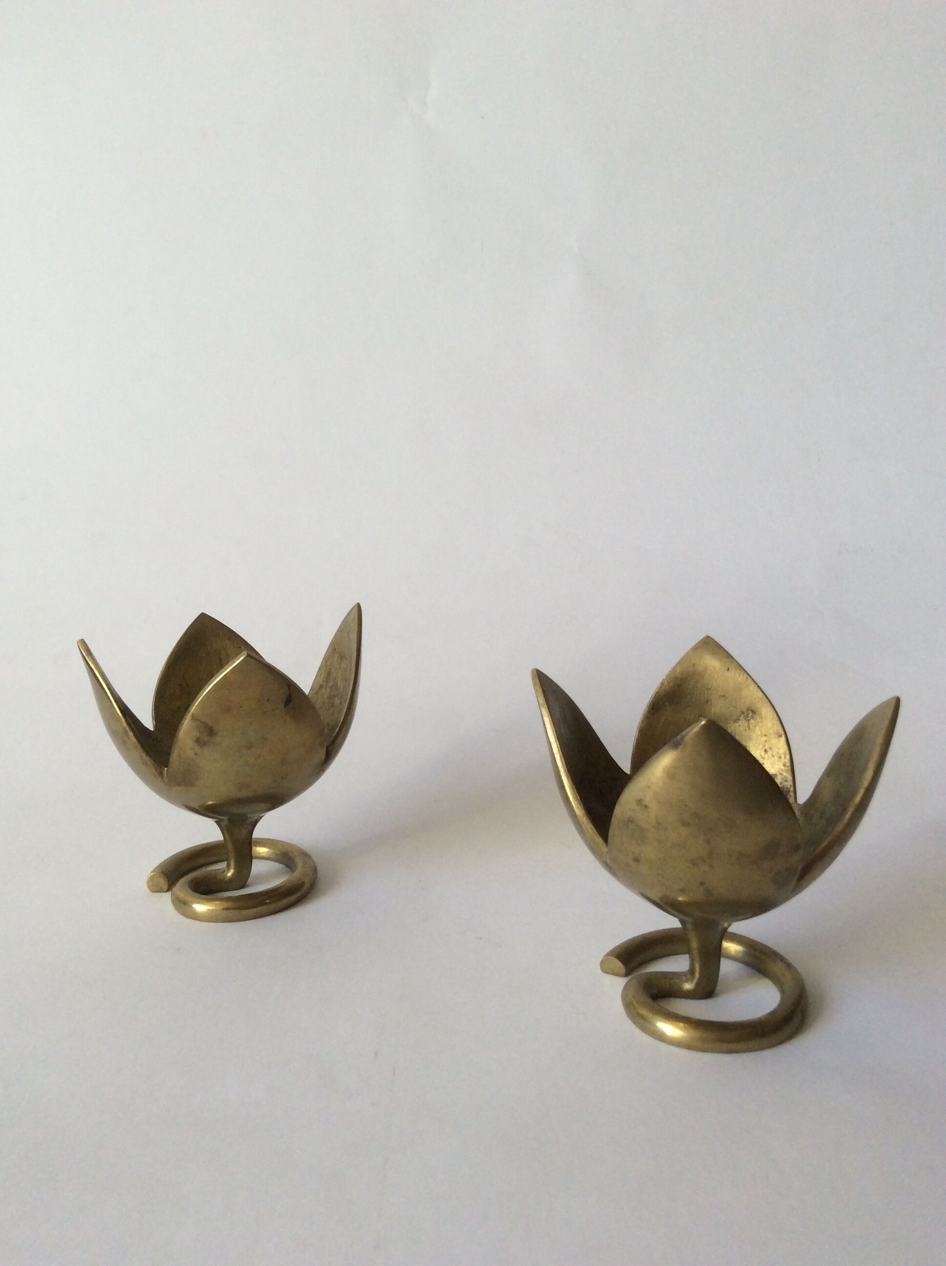 Pair of brass lotus flower candlesticks