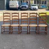 4 or 5 solid wood chairs with light oak straw and high backs