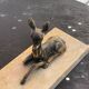 Table lamp, Biche, fawn in gilded brass on a beige marble base, art deco Velvet underside