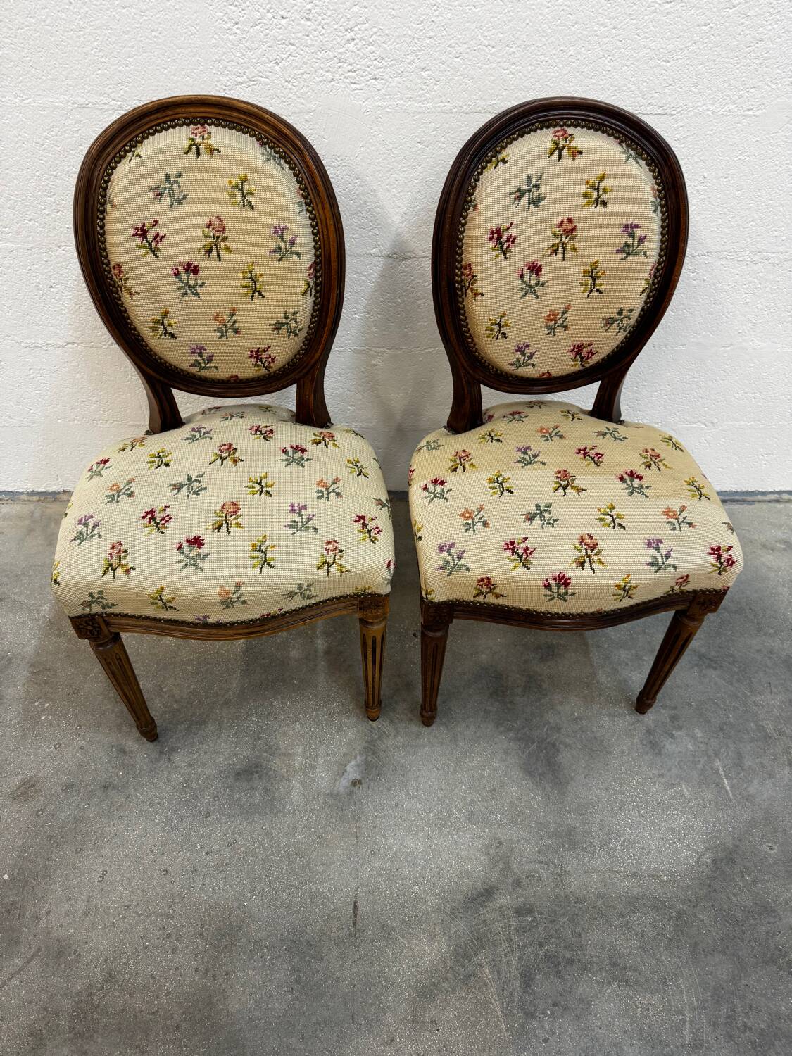 Pair of Louis XVI medallion chairs with canvas.