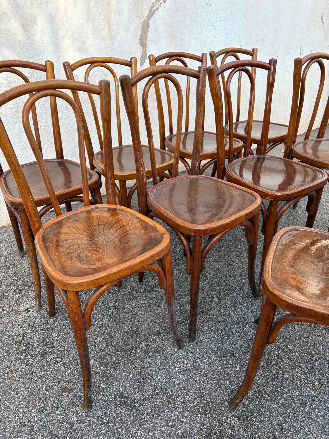 10 varnished patterned bistro chairs