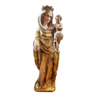 Statue of the Virgin holding the Child Jesus in polychrome terracotta.