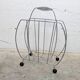 Vintage chrome magazine rack with ball feet