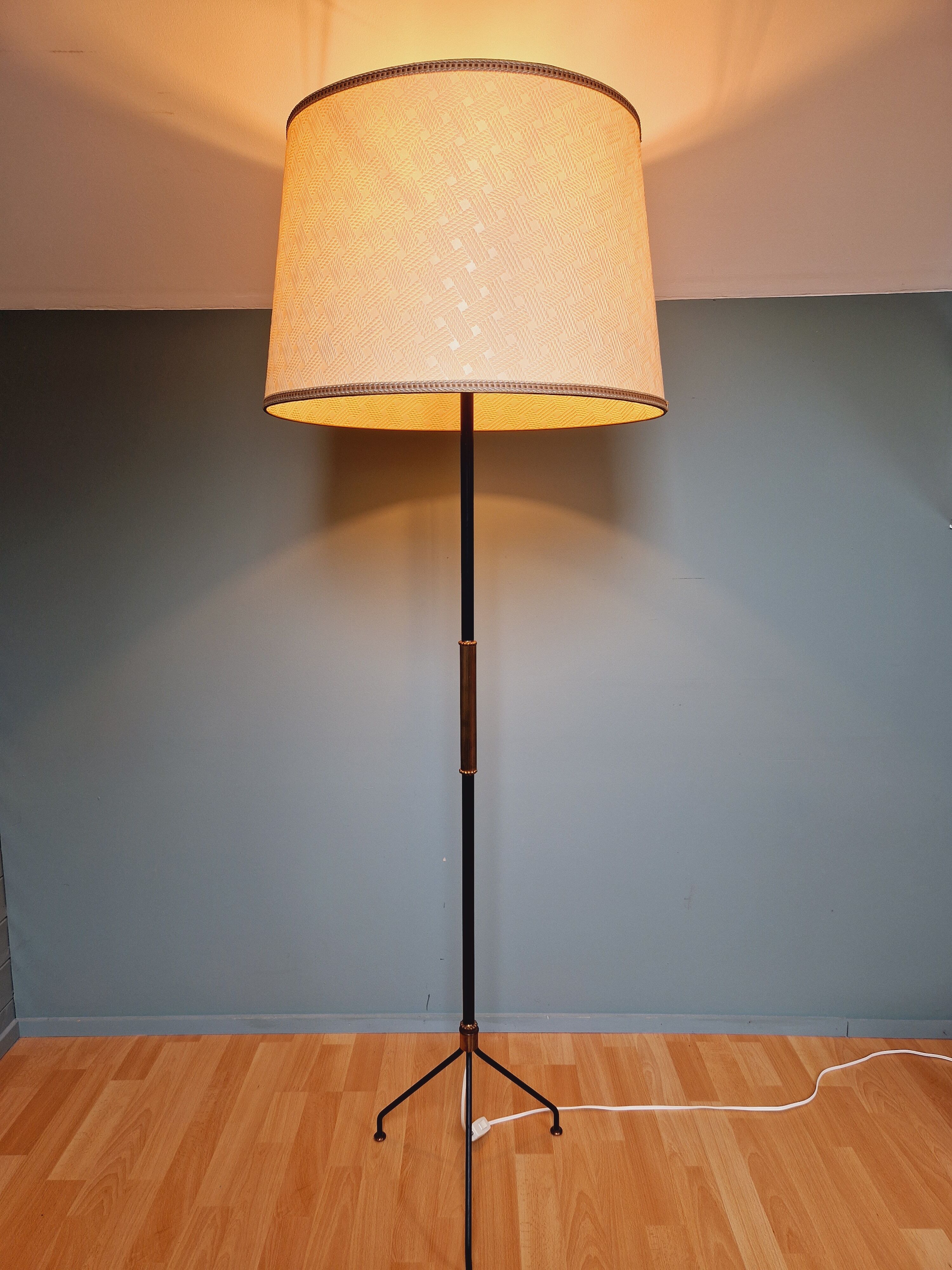 Vintage tripod floor lamp in black lacquered metal and brass, 50s