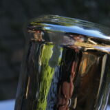 Candle holder in eglomerized glass