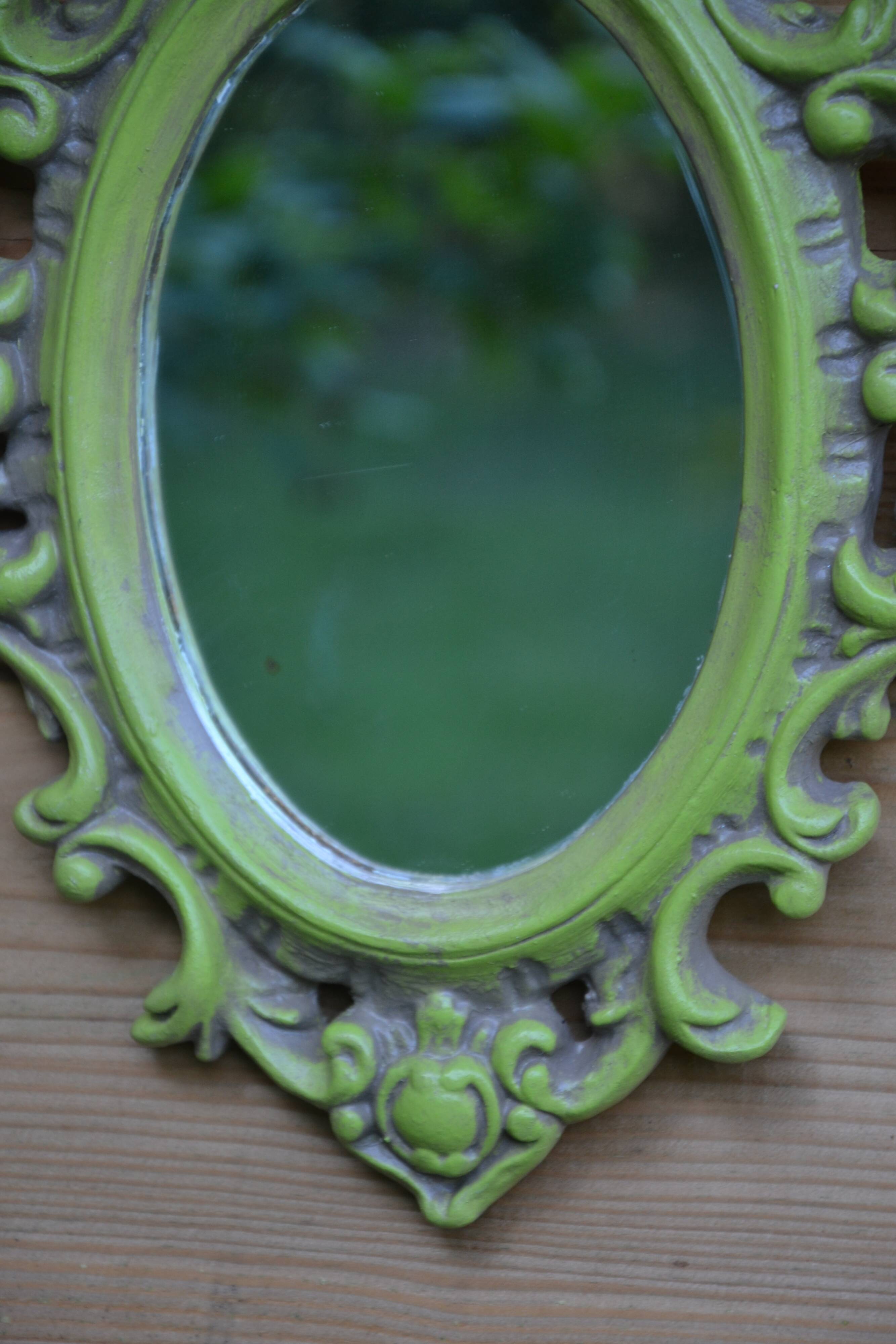 Small green wooden mirror