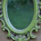 Small green wooden mirror