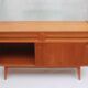 1950s cherry wood sideboard with sliding doors.