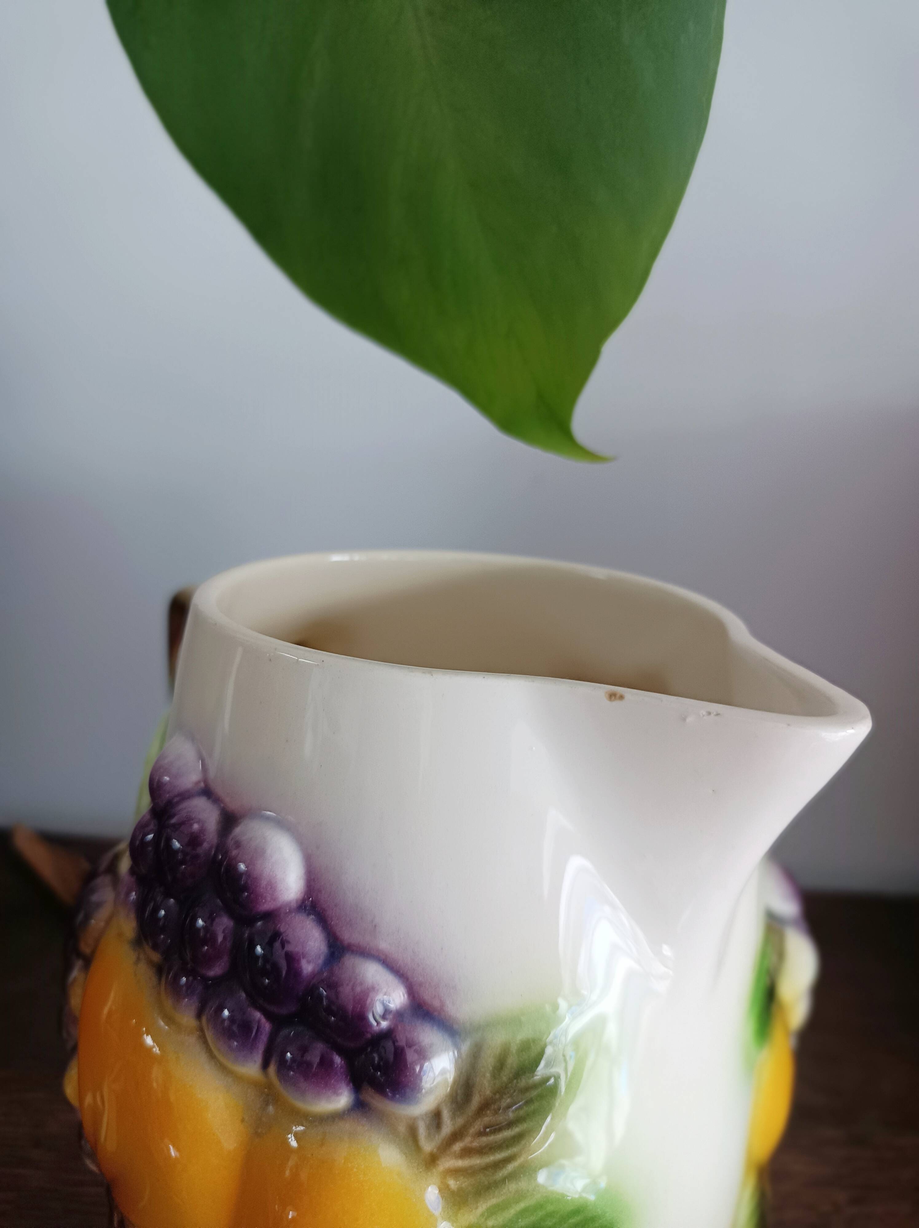 St-Clément pitcher in slip, fruit decoration