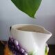 St-Clément pitcher in slip, fruit decoration