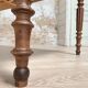 Vintage farmhouse table with turned legs.