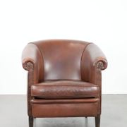 Cognac-coloured cow leather club armchair in English style
