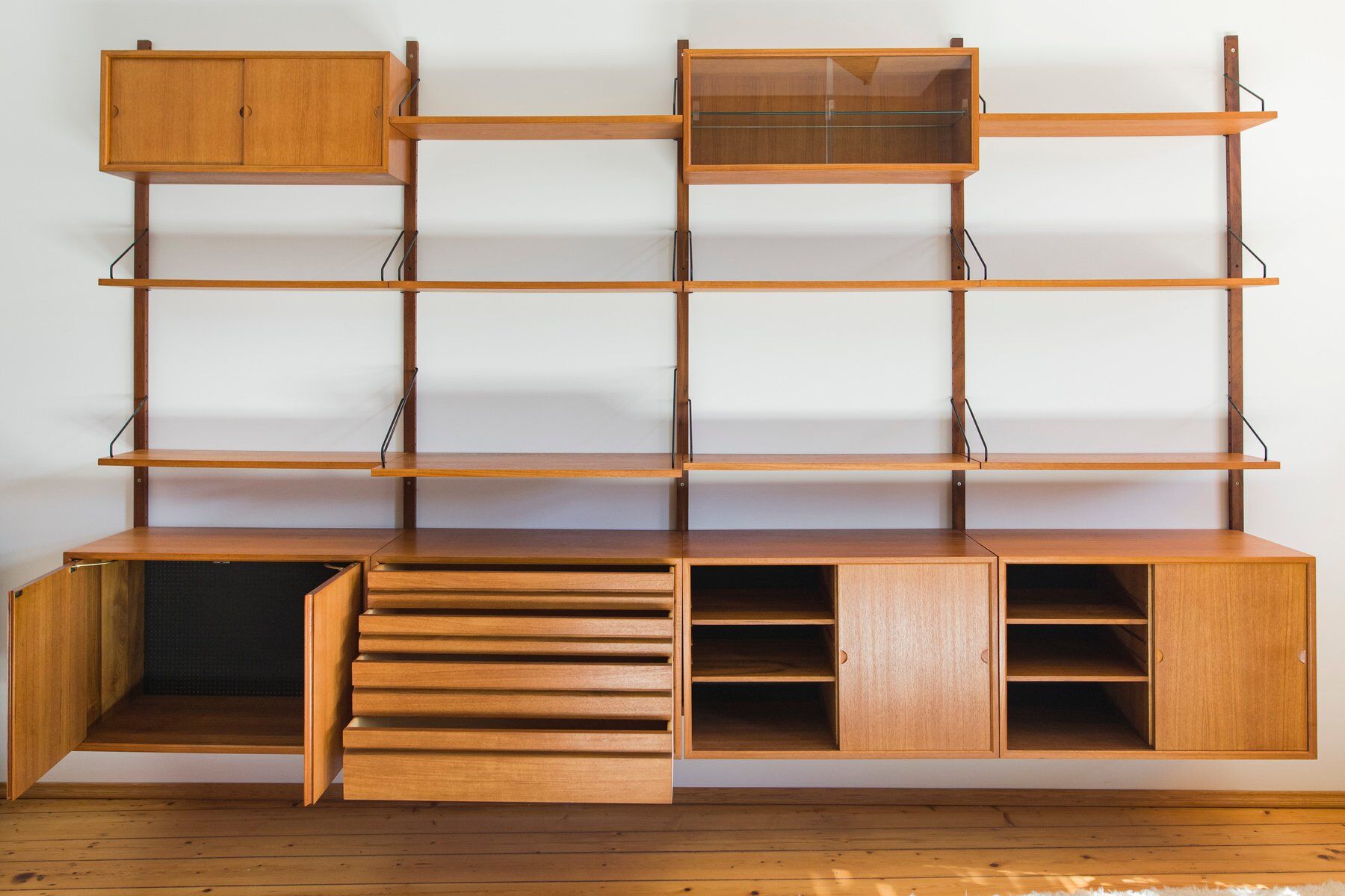 Modular wall shelving system by Poul Cadovius for Cado, 1960s