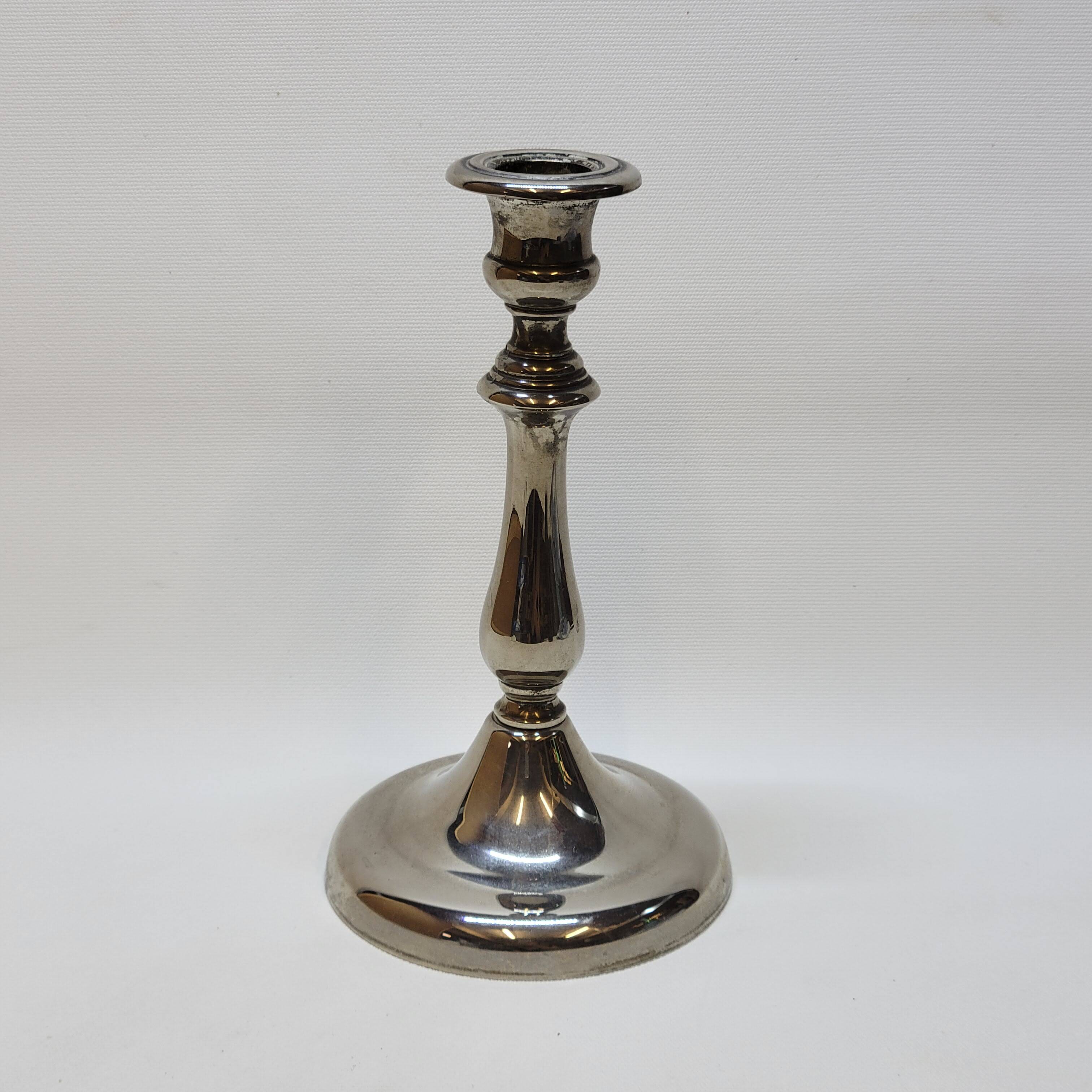 Old candle holder in silver metal