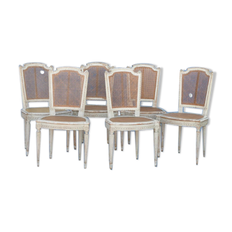 6 white laated canne chairs