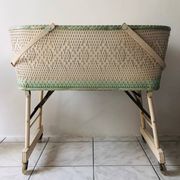 Wood and wicker cradle from the 1950s.