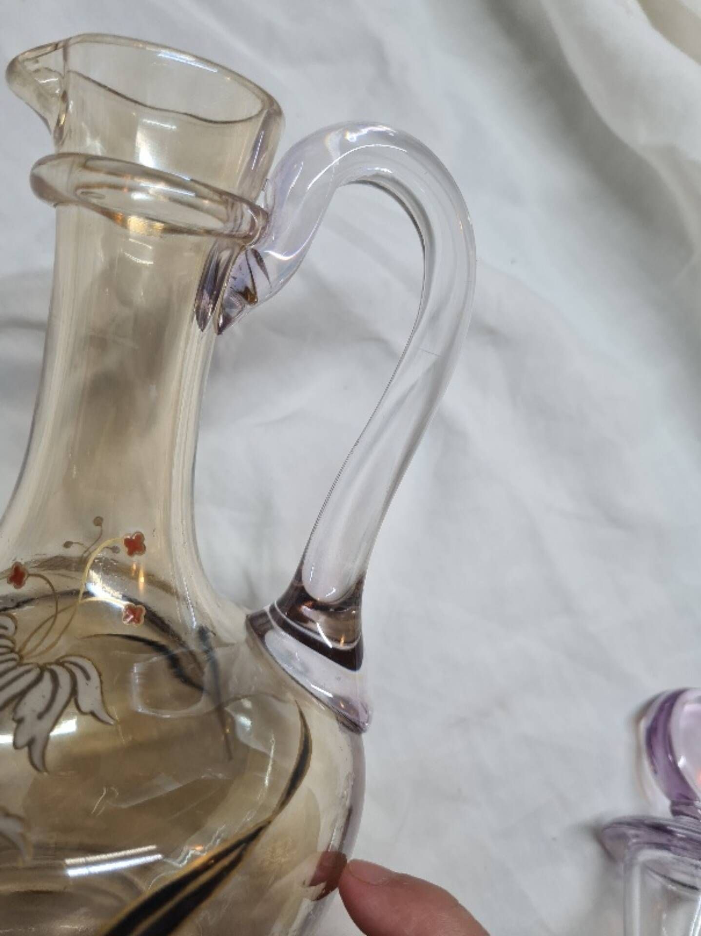 Large Art Nouveau carafe with iridescent enamelled glass and flowers.