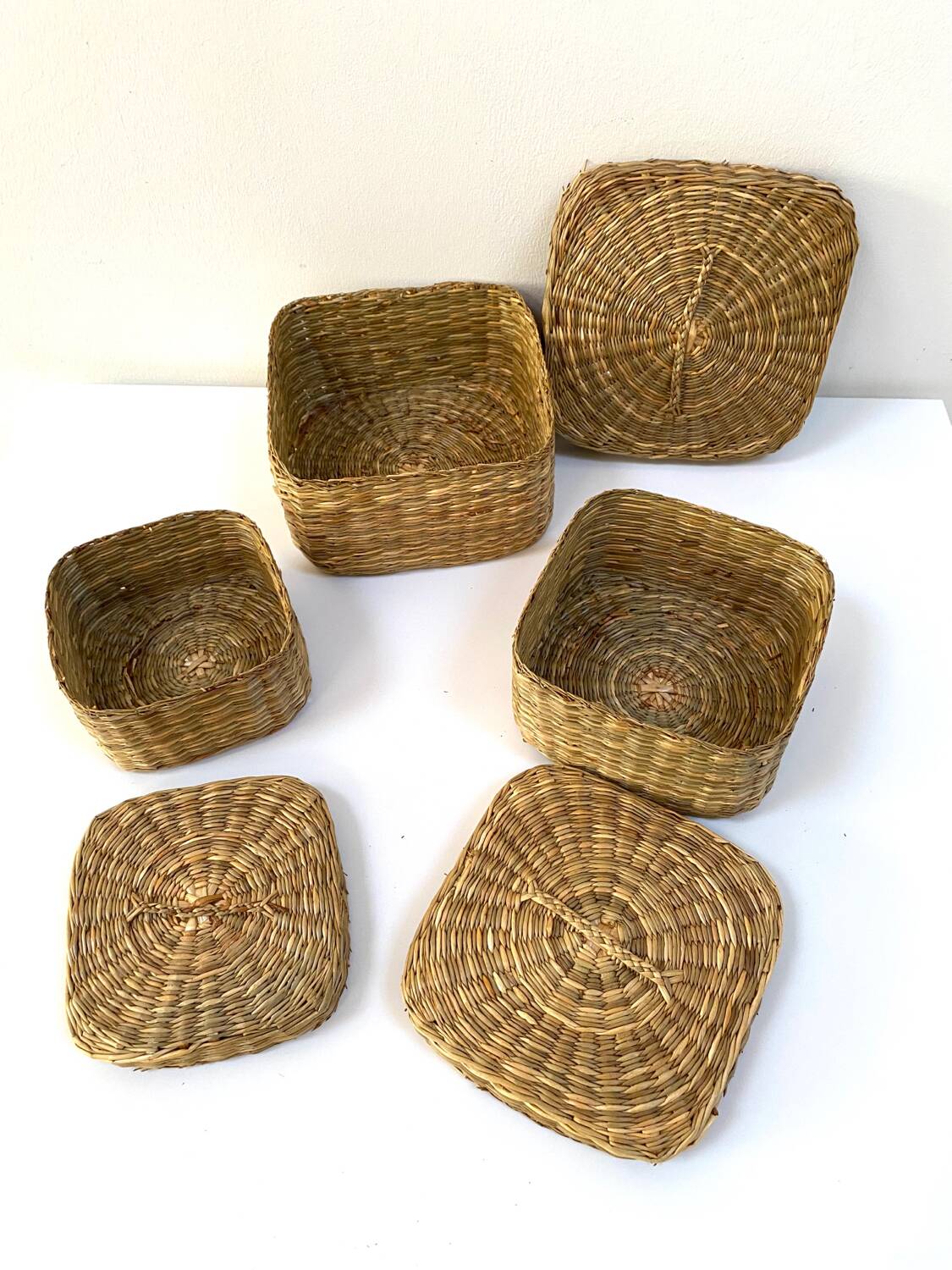 Vintage trio of small rattan nesting baskets