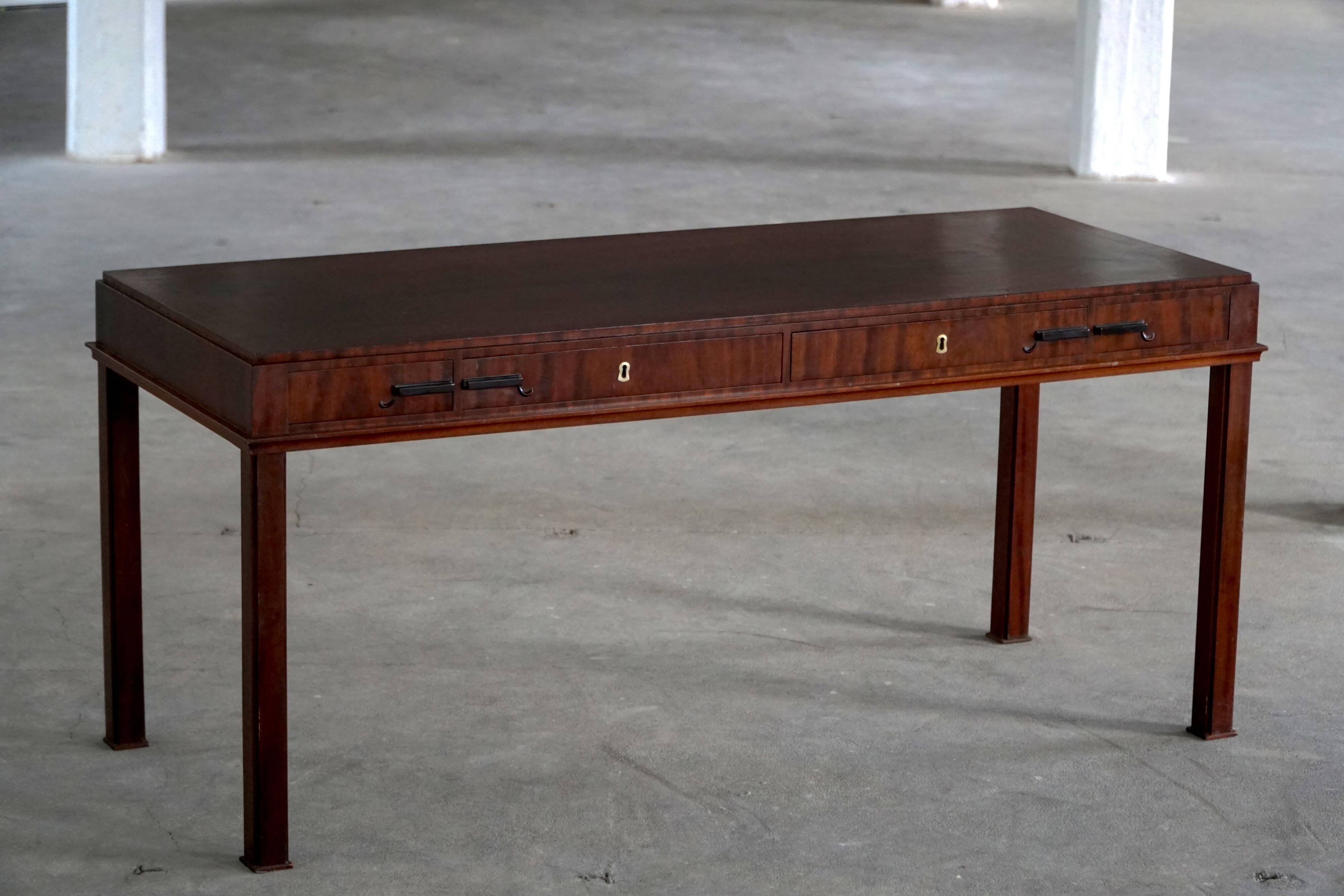 Mid-20th century mahogany writing desk by a Danish cabinetmaker, 1950s.