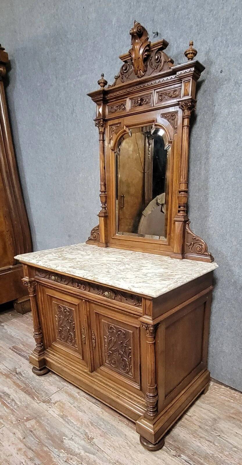 Buffet with mirror in Renaissance style, entirely made of solid walnut.
