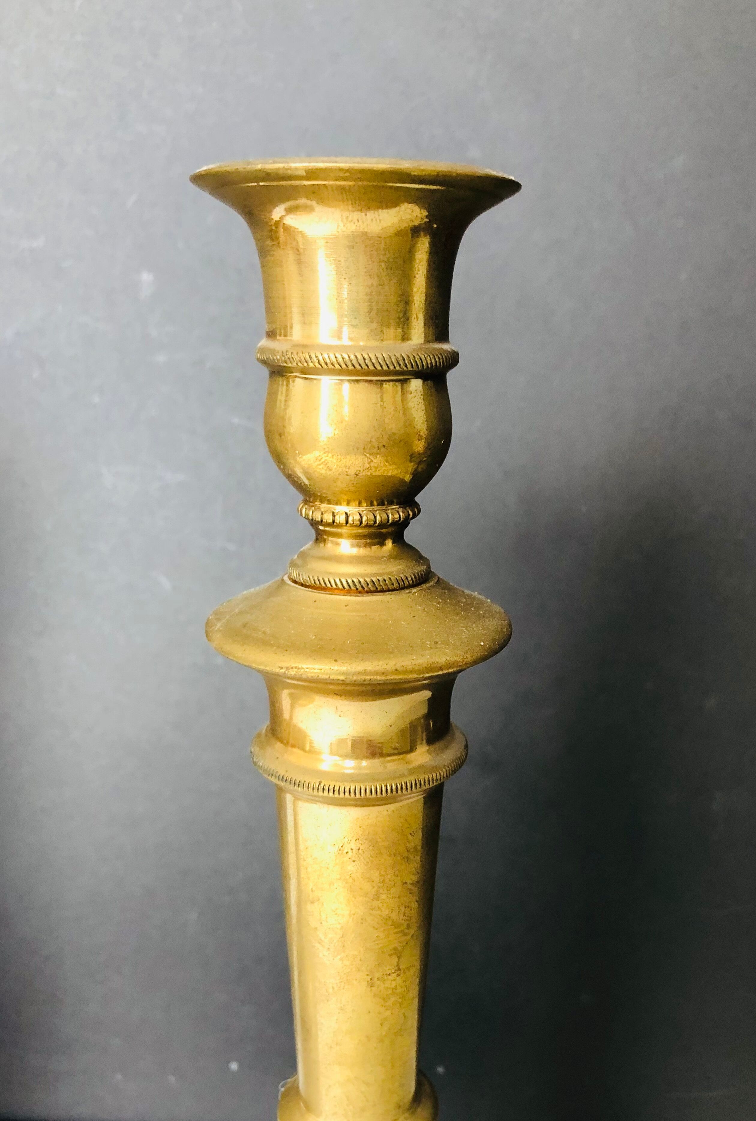 Pair of torches or candle holders in bronze