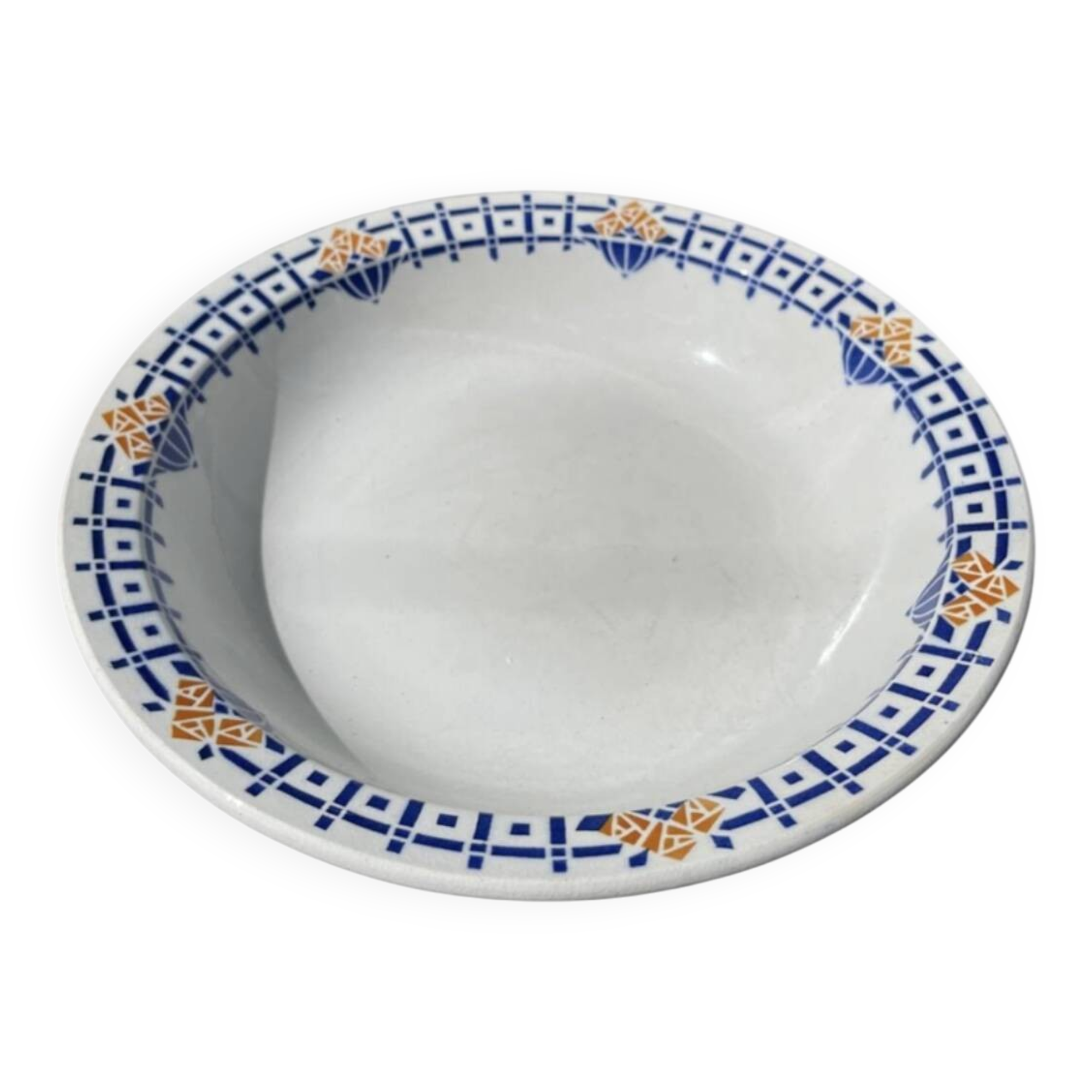 Round, shallow ceramic salad bowl from Saint Amand