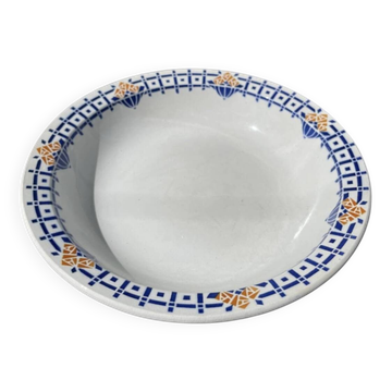 Round, shallow ceramic salad bowl from Saint Amand