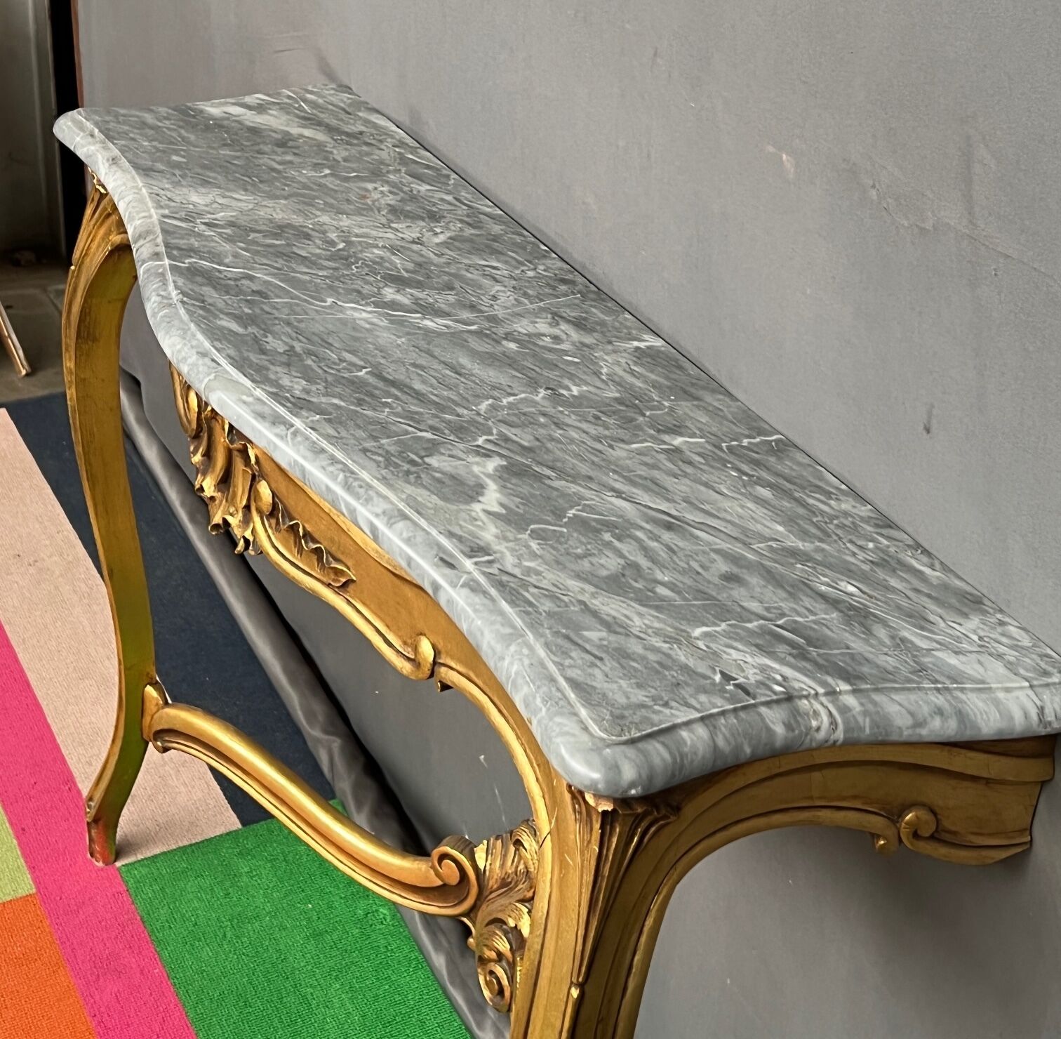 Baroque style console in carved wood with marble top