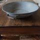 Round zinc basin planter with two handles underneath