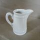 2 small white porcelain pitchers