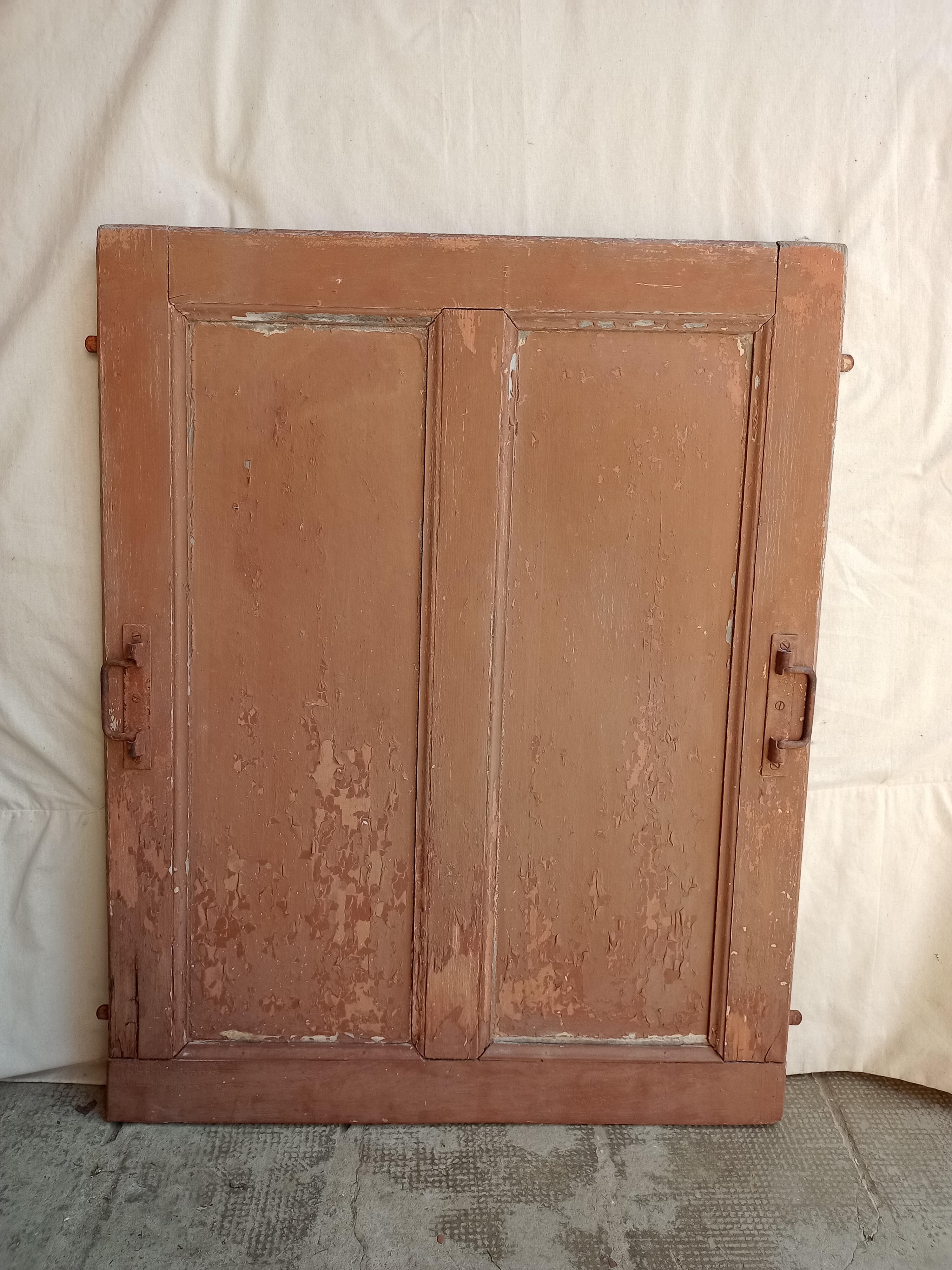 Old glazed door with its shutter
