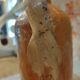 Old bottle in terracotta varnished finish