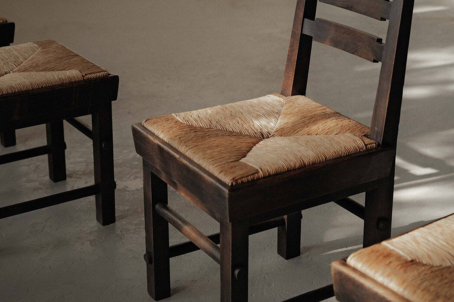 Modernist chairs in oak and woven straw, France, circa 1948
