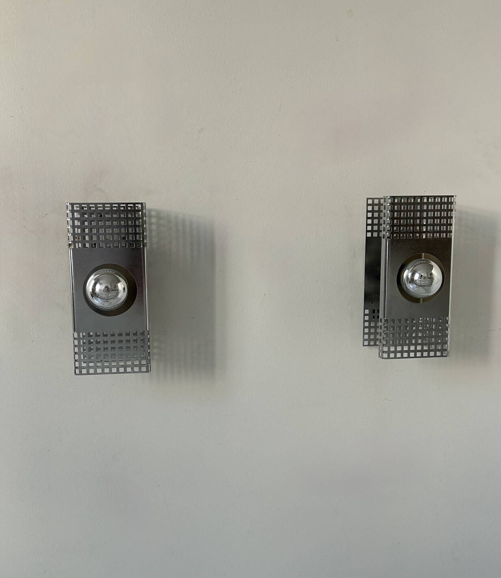 Pair of vintage wall lights, chrome-plated metal, France 1970.