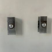 Pair of vintage wall lights, chrome-plated metal, France 1970.