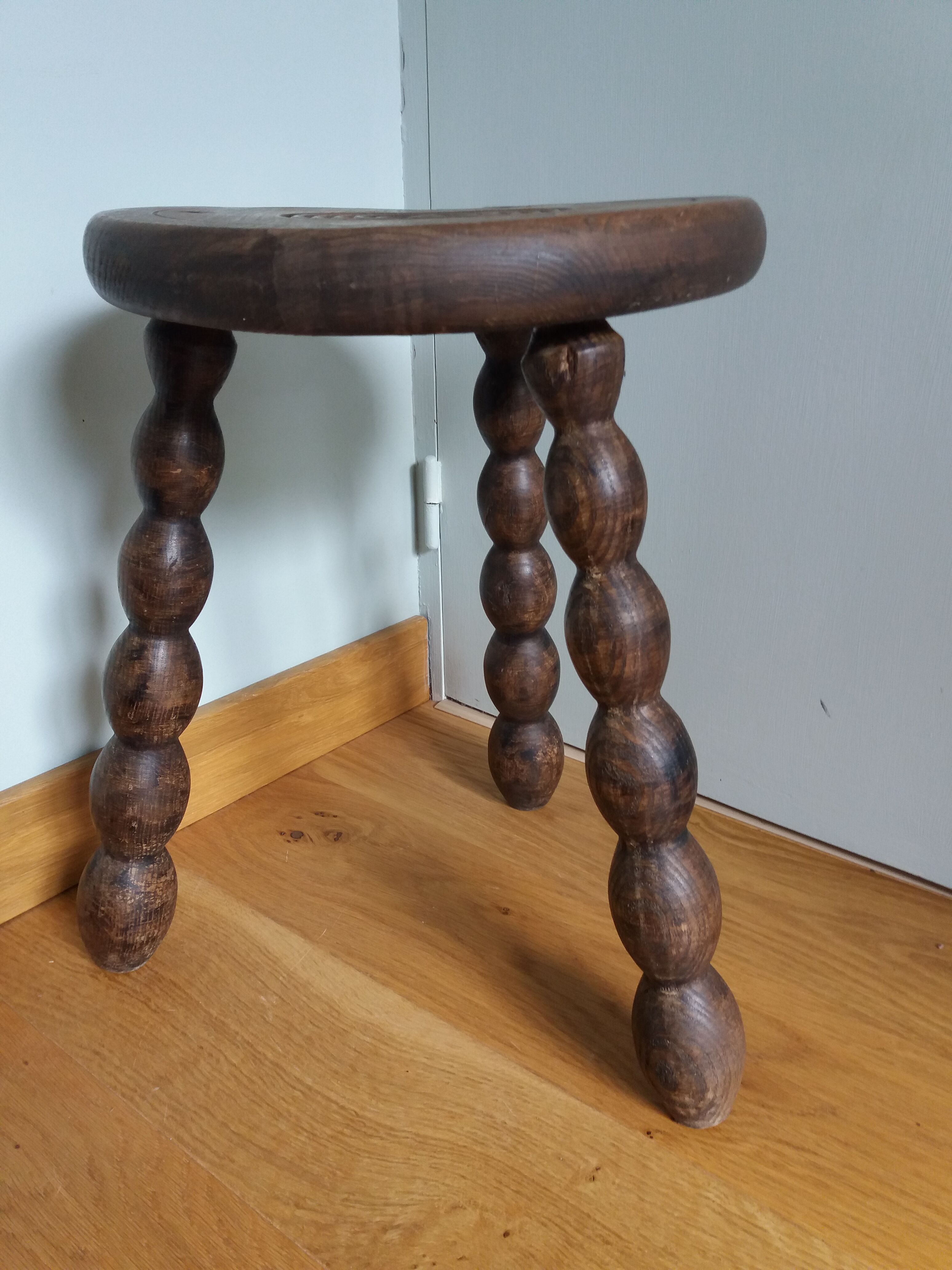 Tripod stool in wood turned coil way