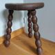 Tripod stool in wood turned coil way