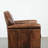 Beautiful vintage sheep leather armchair with a characterful appearance