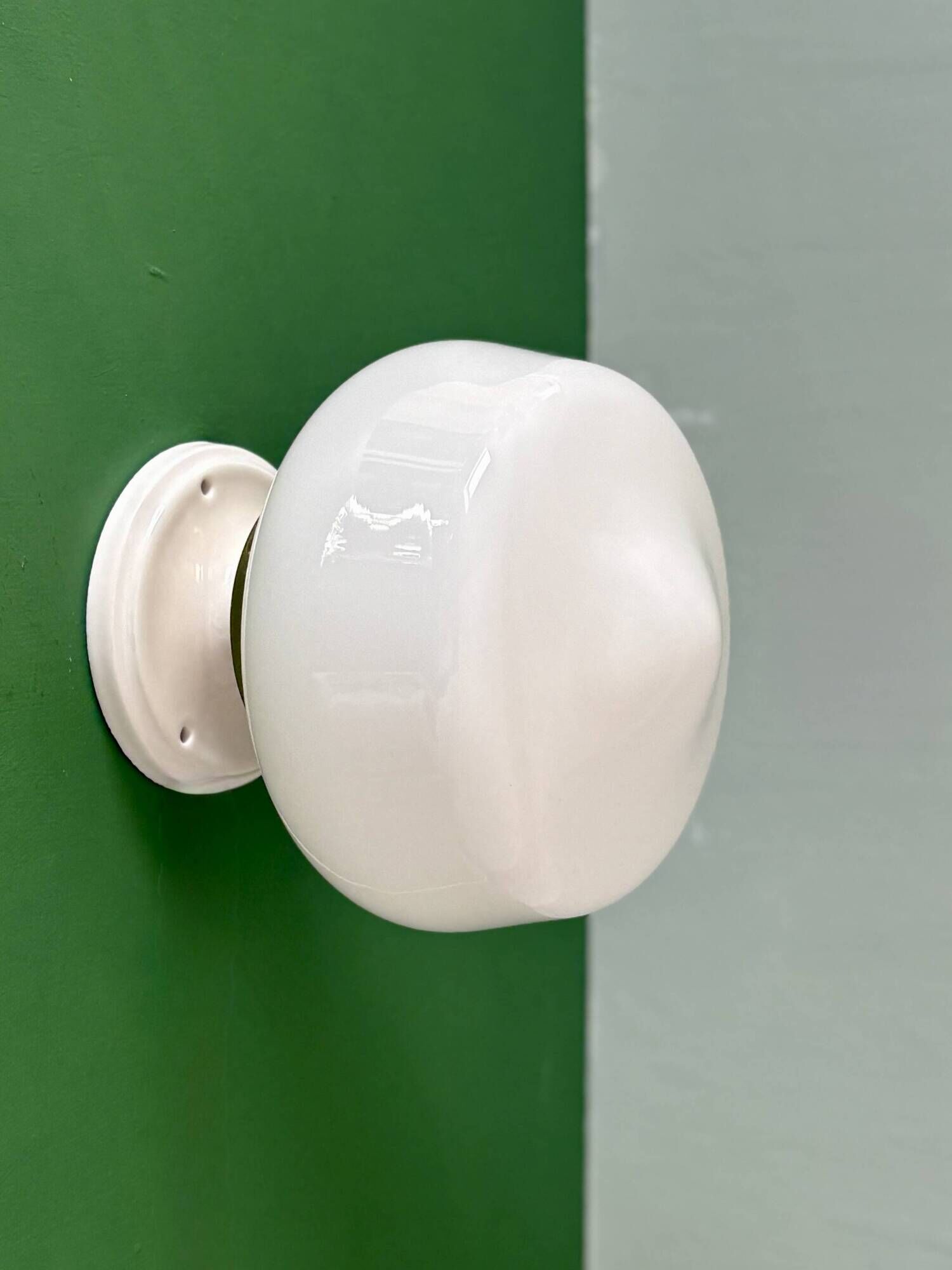 Vintage Art Deco globe wall light in white opaline.